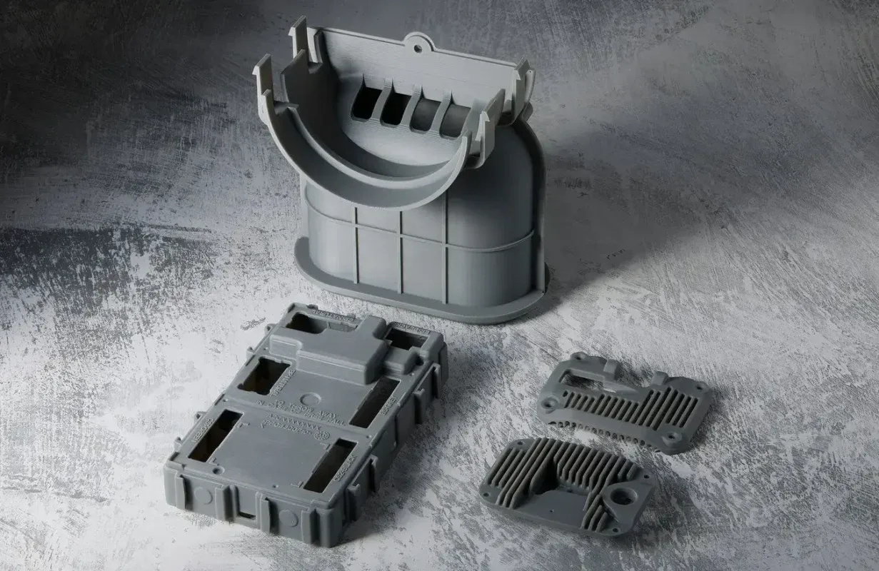 Standard grey resin 3D printed parts displaying sharp details and smooth surface
